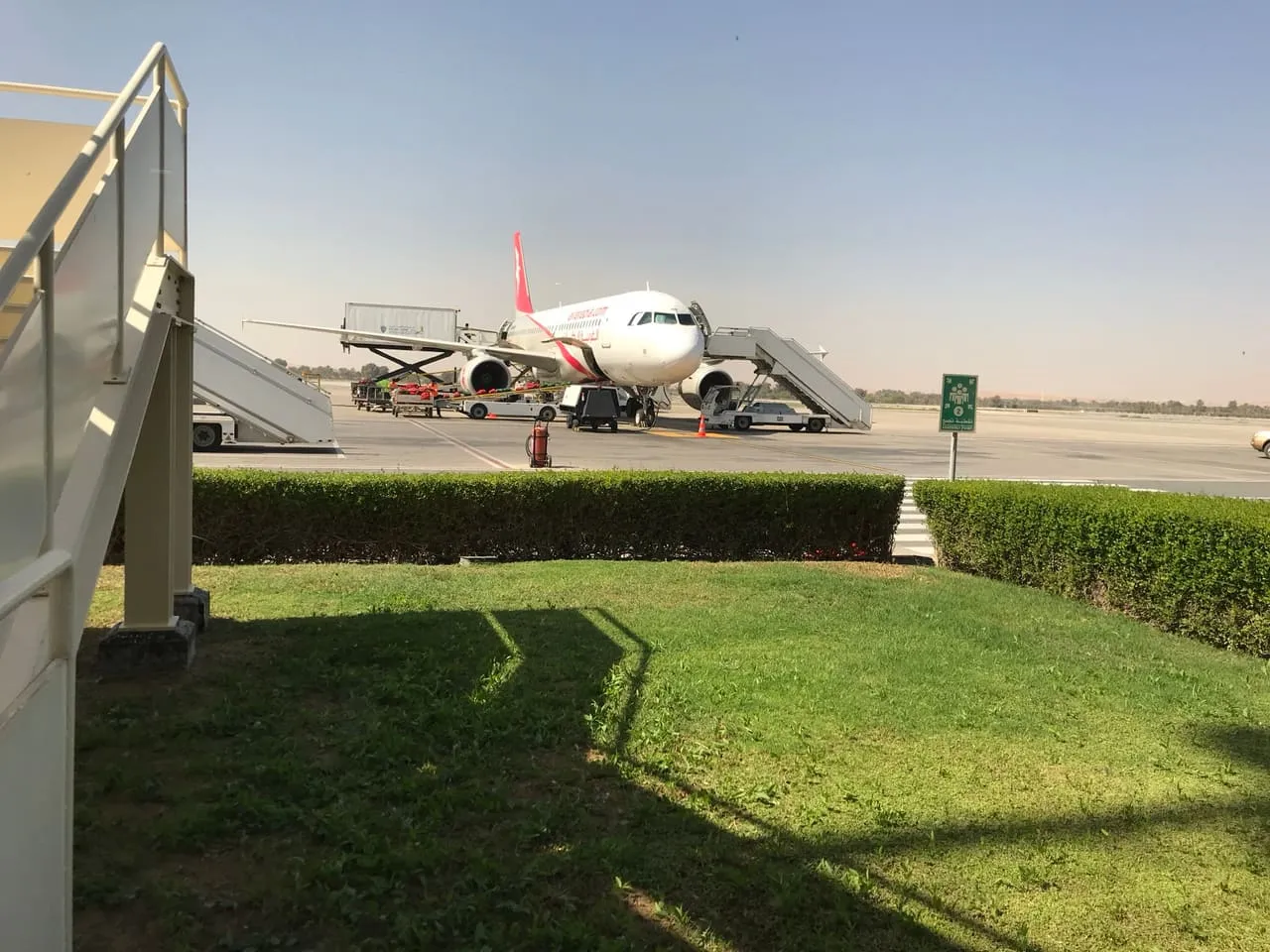 An Air Arabia Airbus A320 parked on the apron at Ras Al Khaimah International Airport