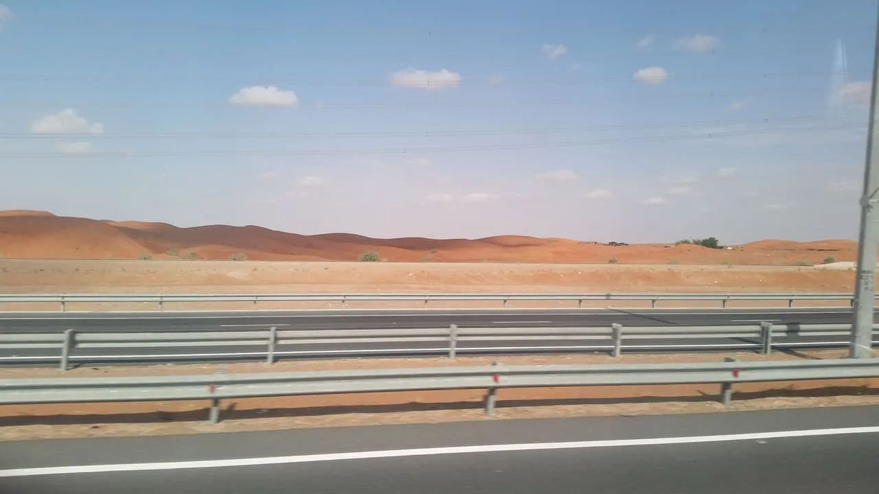 Red sand dunes beside the Dubai to Al Ain Road