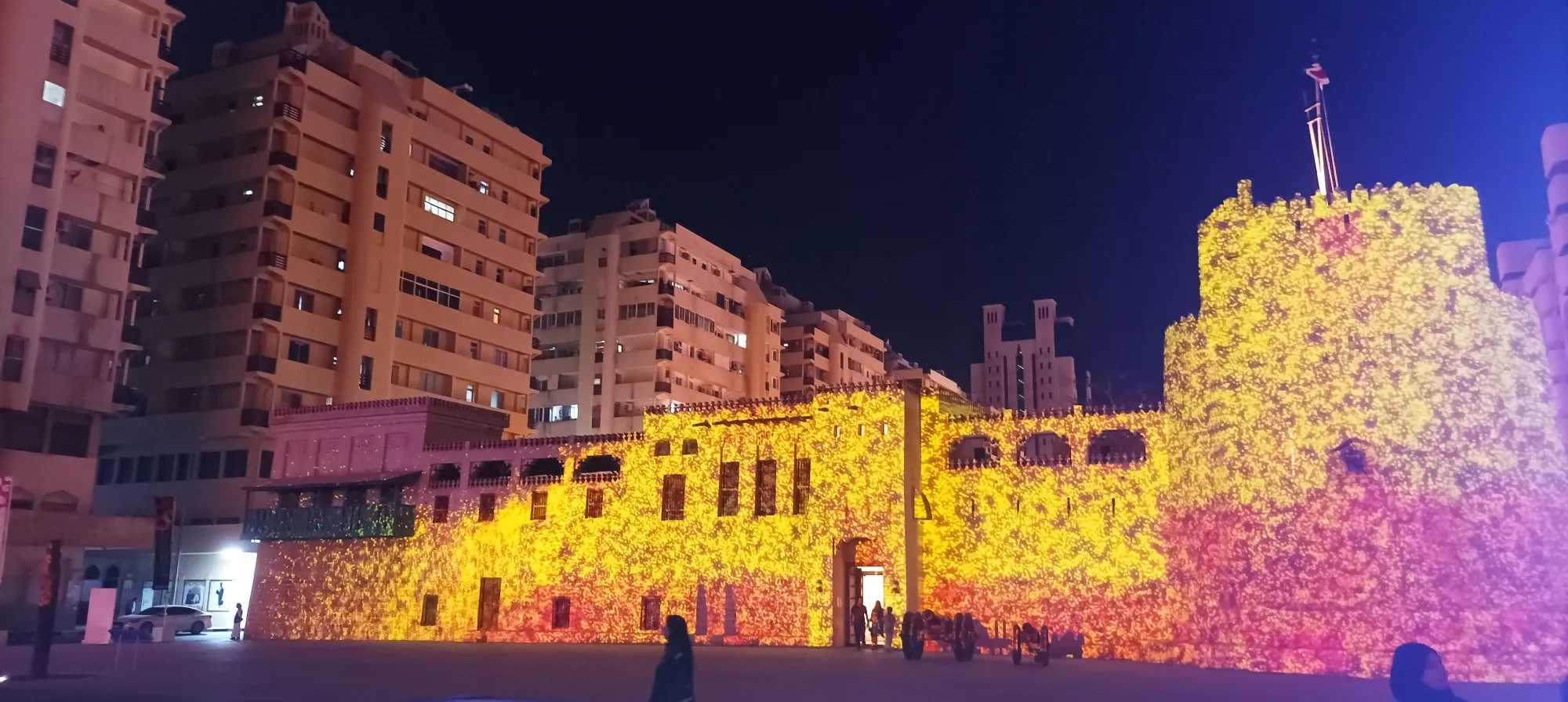 Sharjah Fort (Al Hisn) covered in yellow and pink projected light during the Sharjah Light Festival
