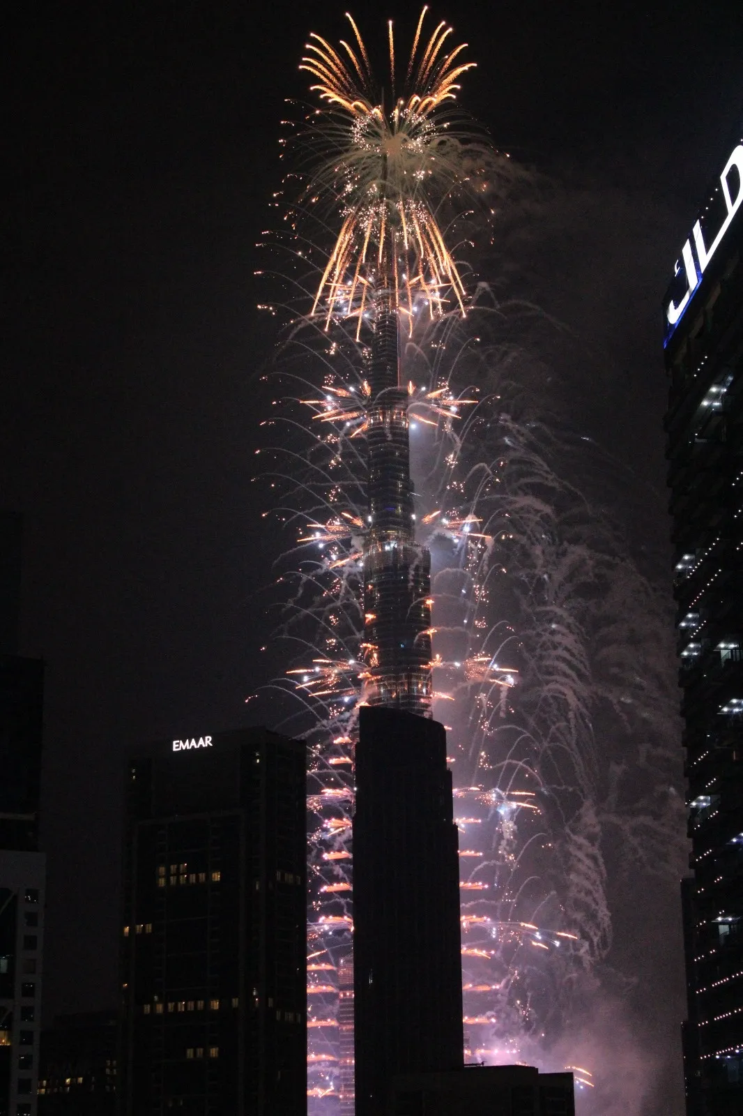 Fireworks running down the Burj Khalifa in Downtown Dubai at night