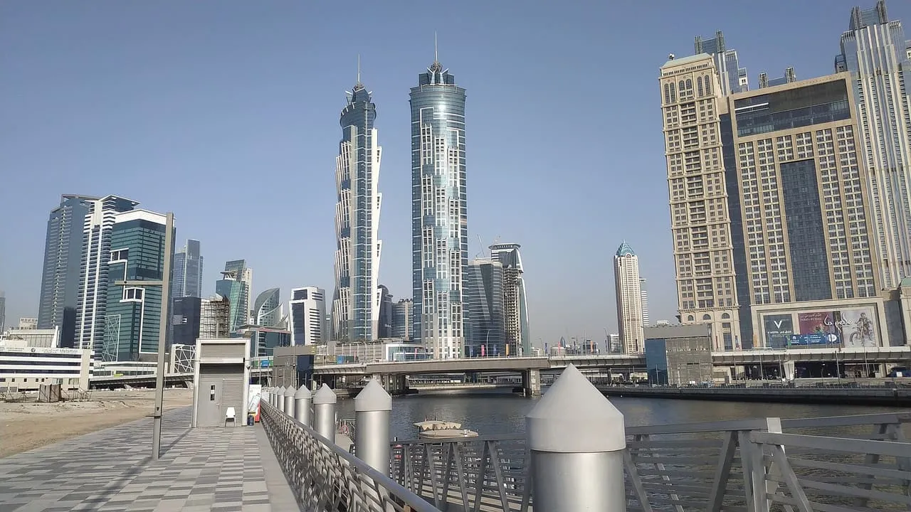 A boat jetty on the Dubai Water Canal in Business Bay, with the twin JW Marriott Marquis towers behind
