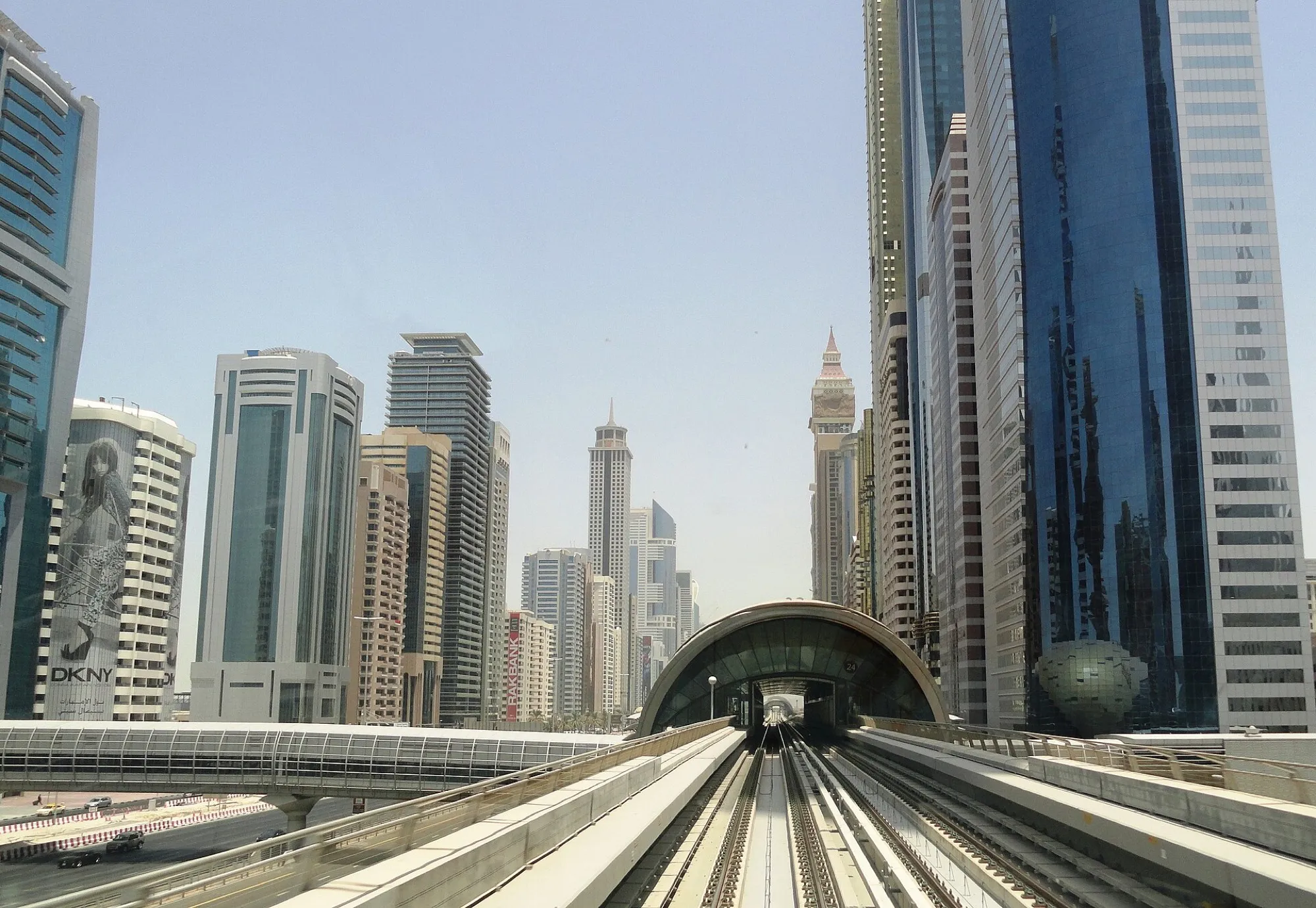 A Dubai Metro viaduct running between the towers along Sheikh Zayed Road