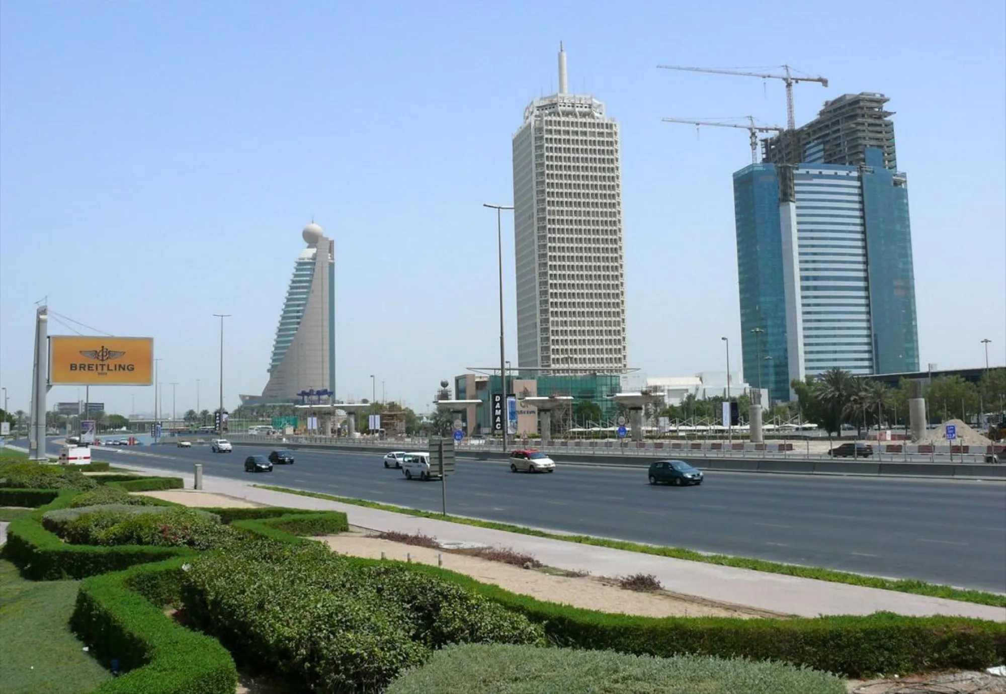Sheikh Zayed Road outside Dubai World Trade Centre, with the Trade Centre tower and Etisalat Tower 2 behind