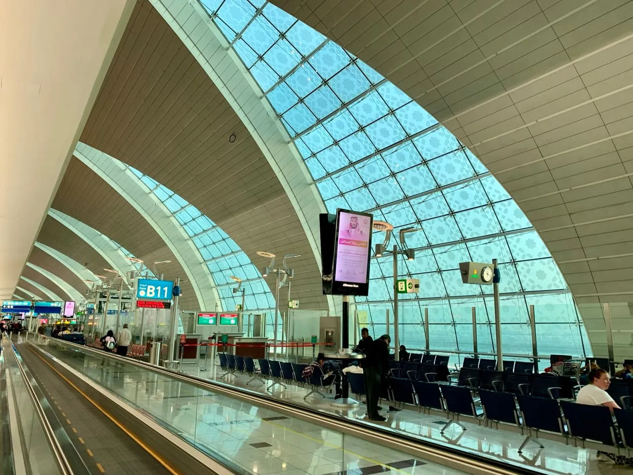 Gate B11 under the arched glass roof of Terminal 3 at Dubai International
