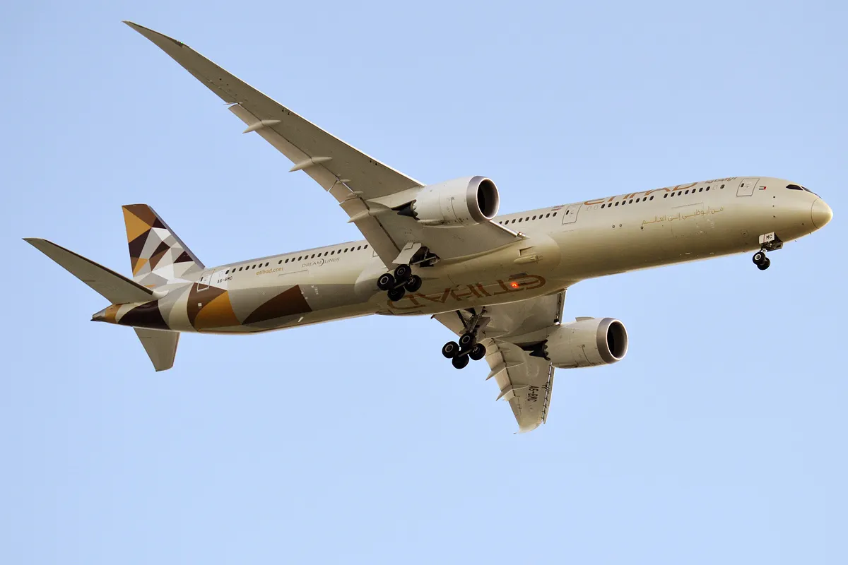 An Etihad Airways Boeing 787-10 Dreamliner in the air over Abu Dhabi airport