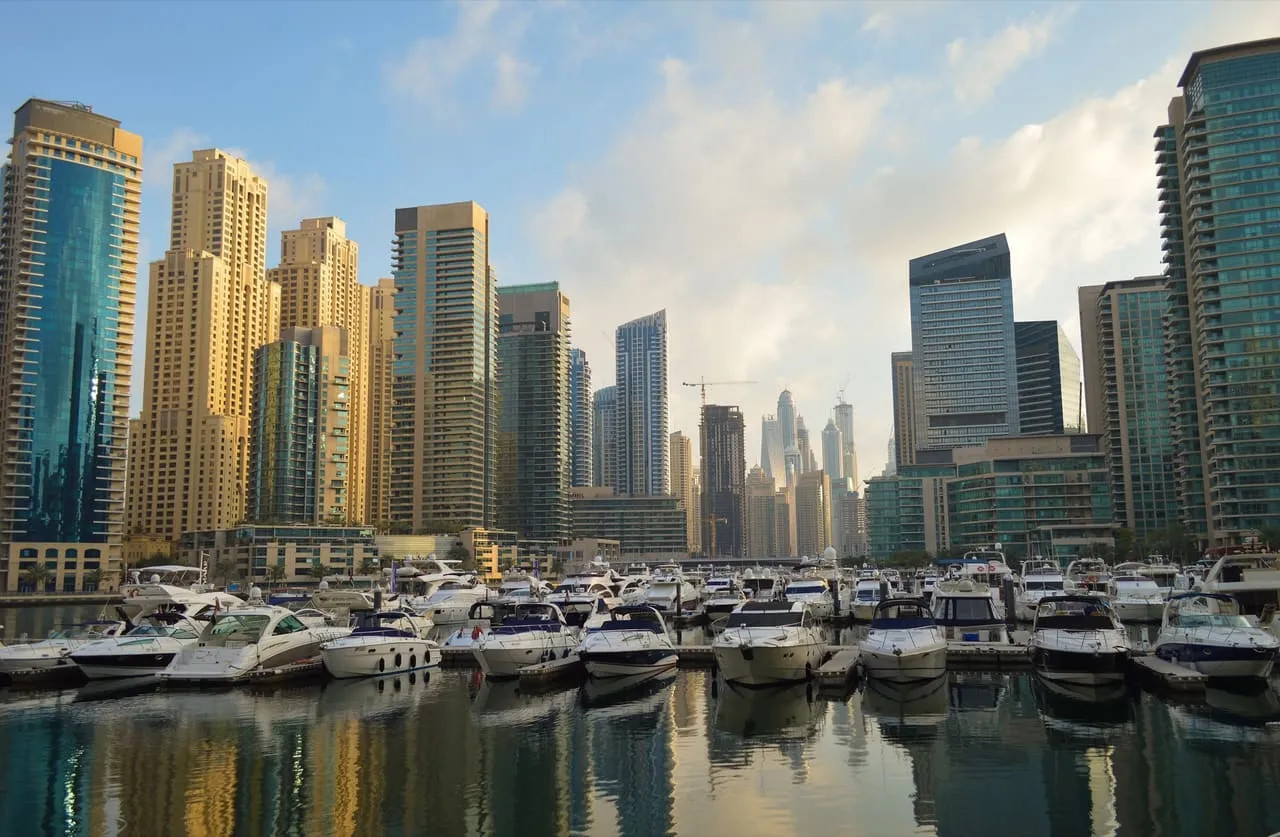 Motor yachts moored in Dubai Marina below the district's residential towers