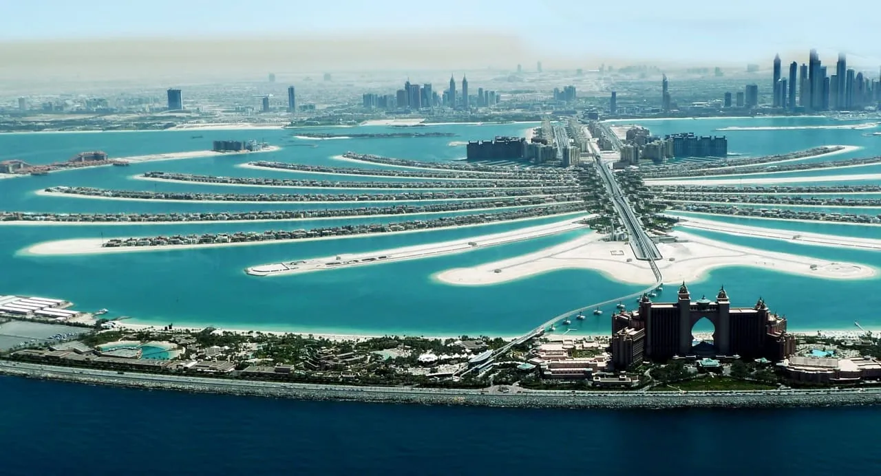Palm Jumeirah from the air, with Atlantis on the outer crescent and the Dubai Marina towers behind