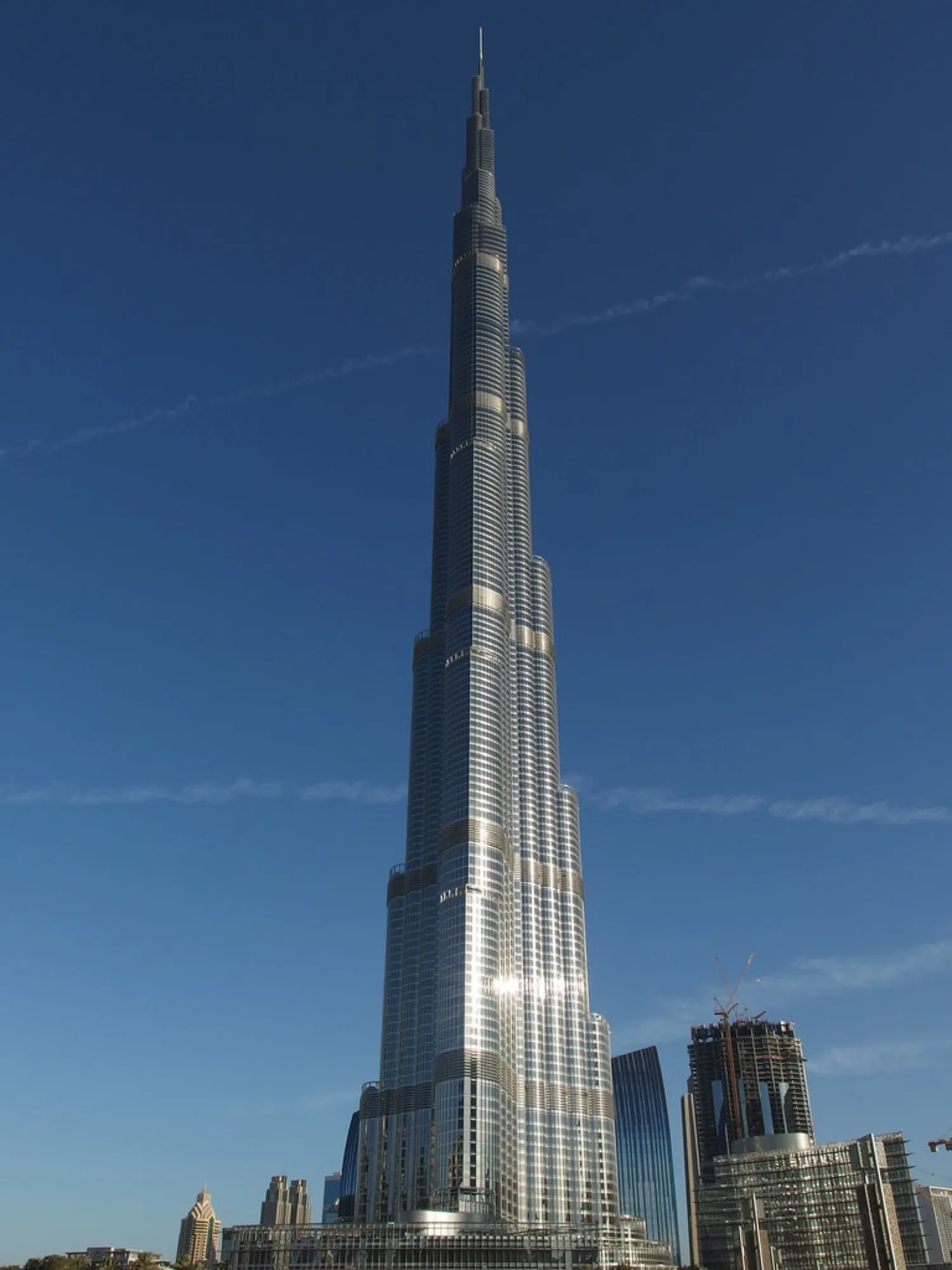 The Burj Khalifa rising above Downtown Dubai against a deep blue sky