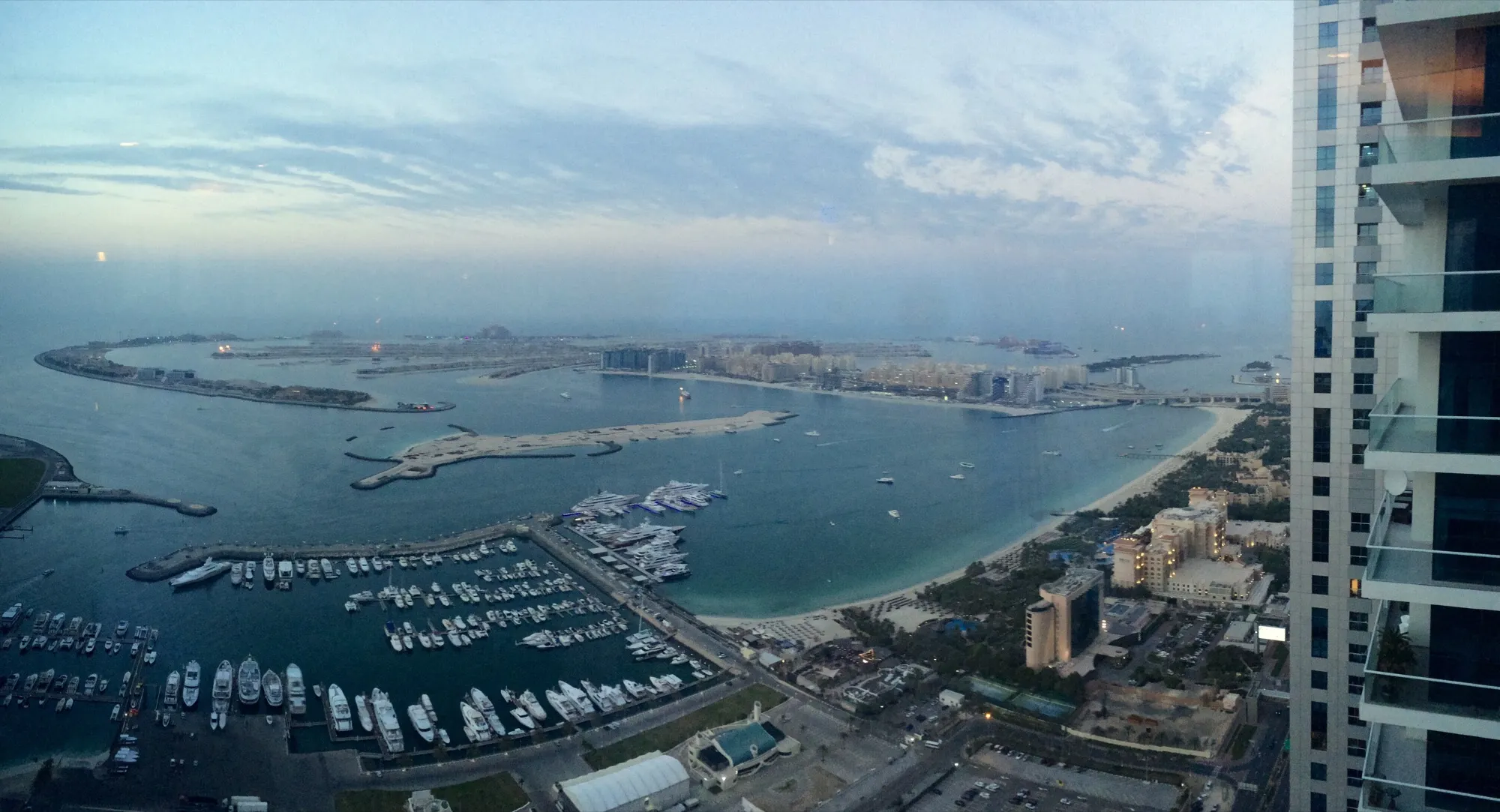 The Palm Jumeirah crescent and trunk seen from a tower beside Dubai Marina