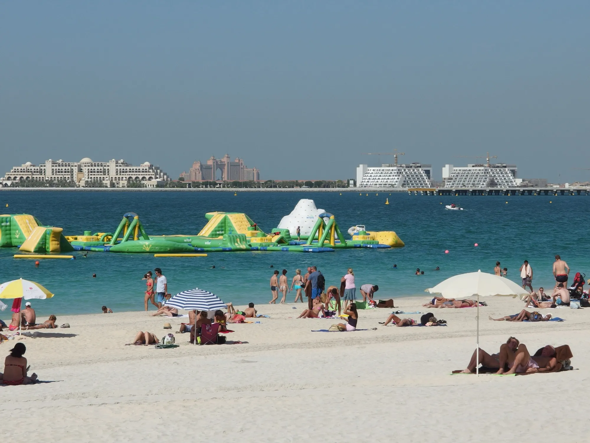 JBR beach with the Palm Jumeirah and hotels on the horizon, seen from Jumeirah Beach Residence