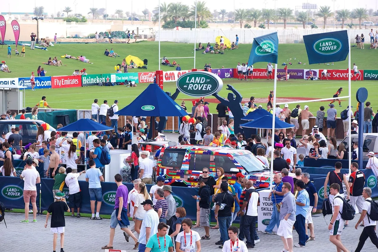 Crowds in a sponsor fan zone beside the pitches at the 2012 Dubai Rugby Sevens