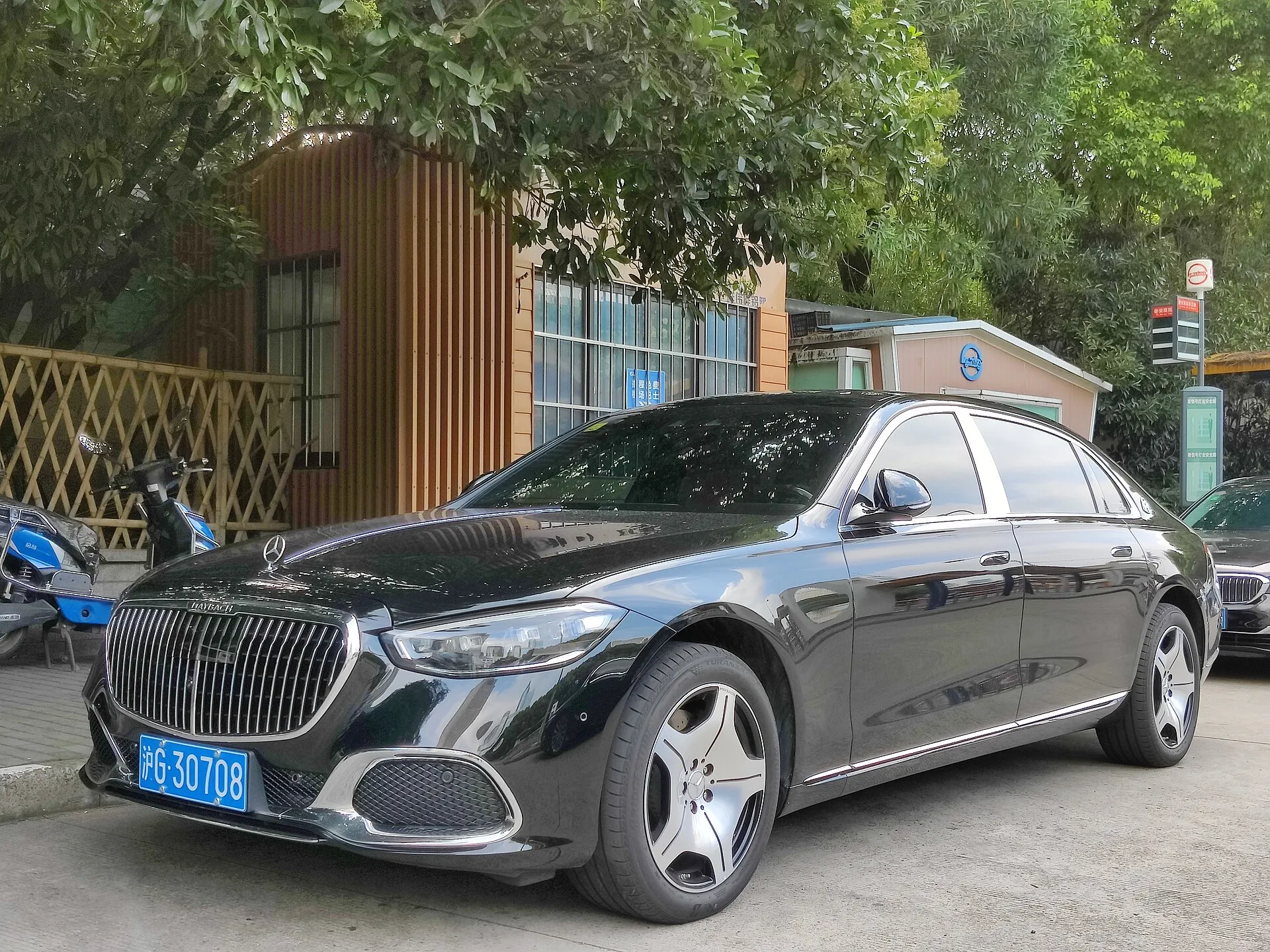 A black Mercedes-Maybach S-Class parked at the kerb, seen from the front right
