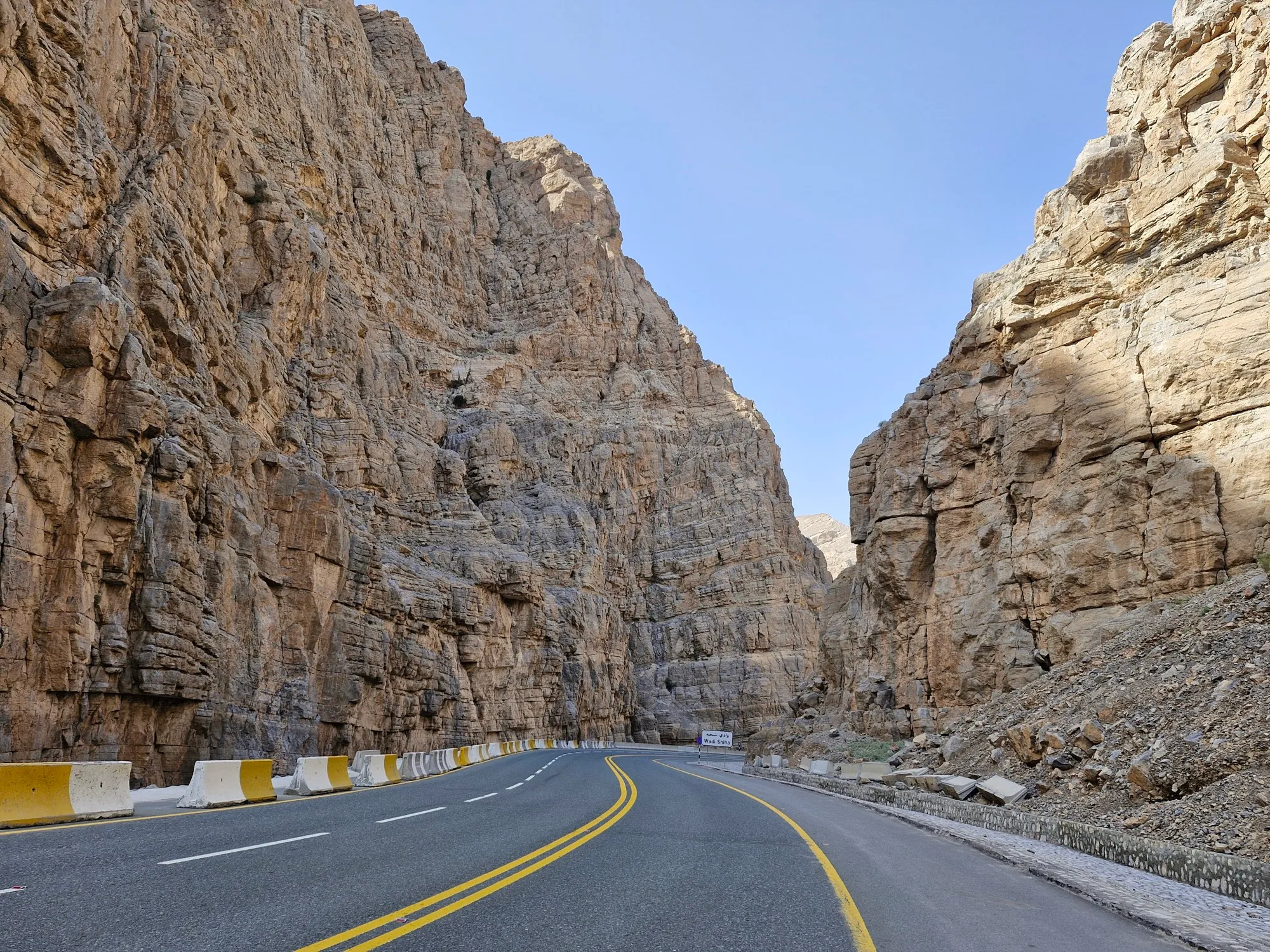 The paved Jebel Jais road winding through the rock walls of Wadi Shiha in Ras Al Khaimah