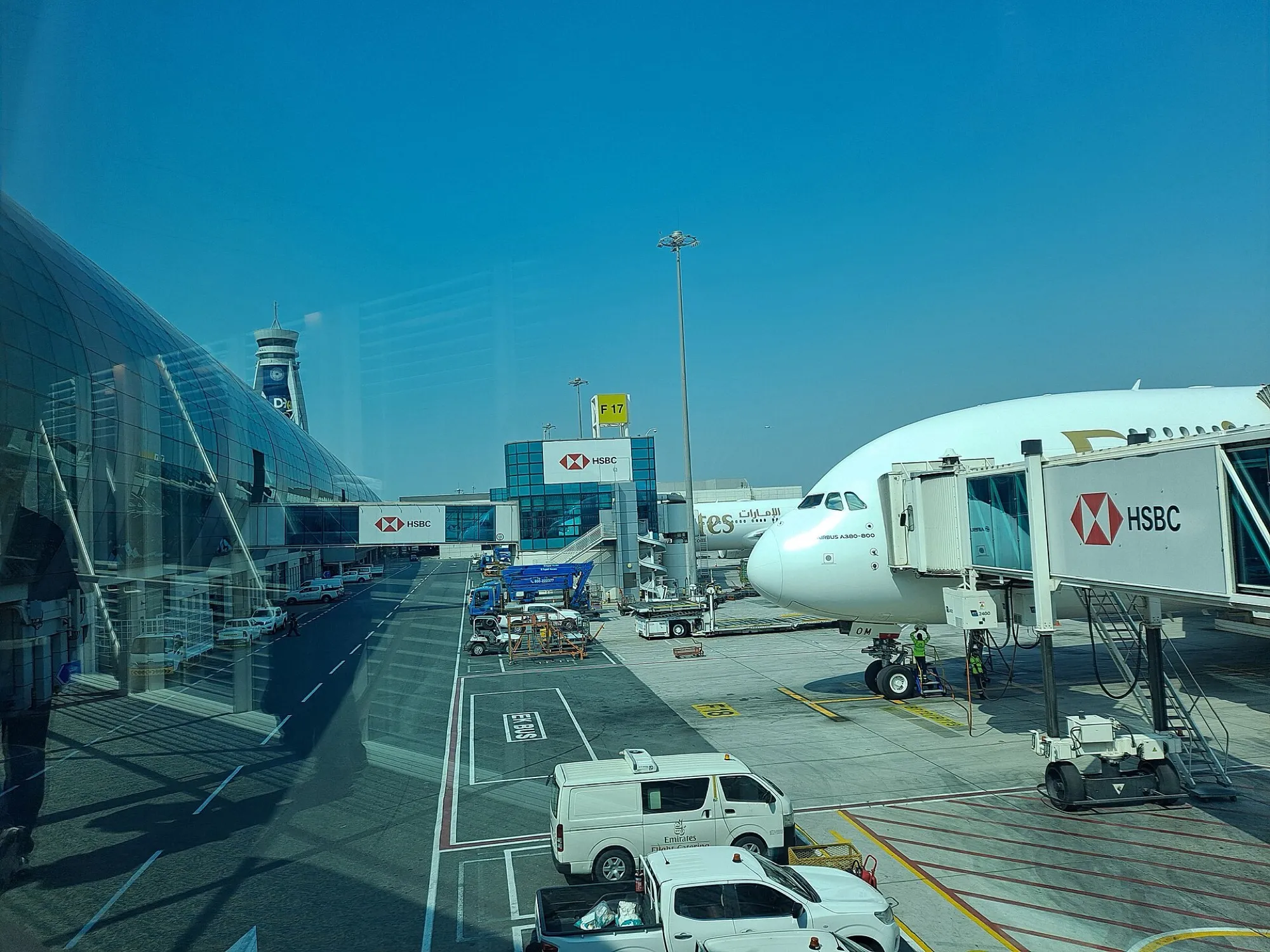 Aircraft gates and an Emirates A380 on the apron at Dubai International Airport Terminal 3