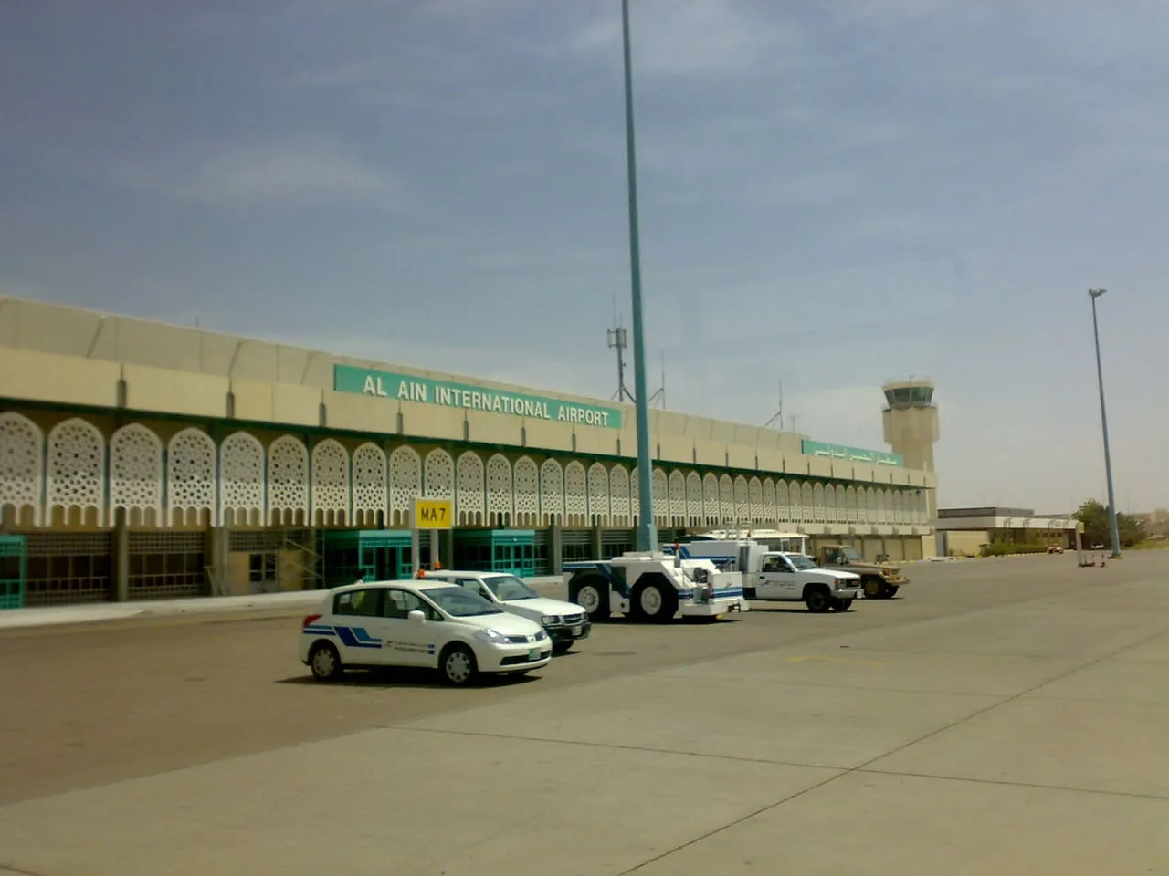 The terminal building at Al Ain airport (AAN), seen from the apron under its old Al Ain International Airport sign