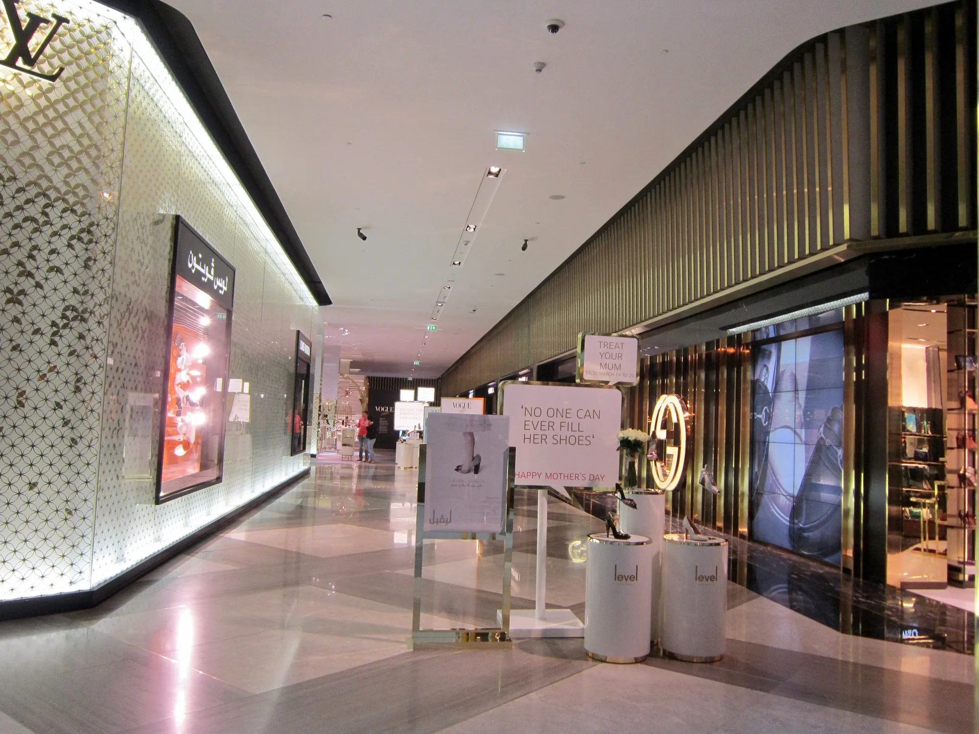 A quiet luxury shopping corridor inside The Dubai Mall