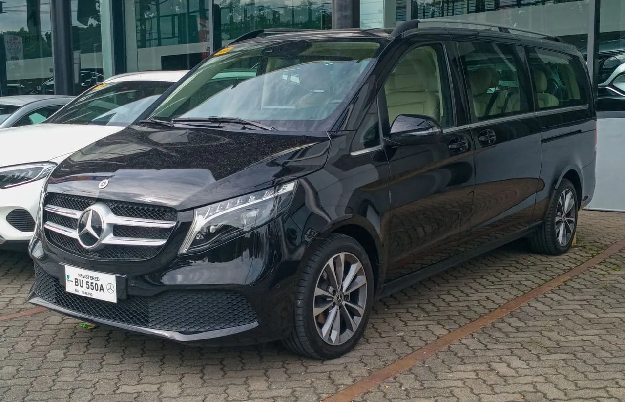 A black Mercedes-Benz V-Class people carrier