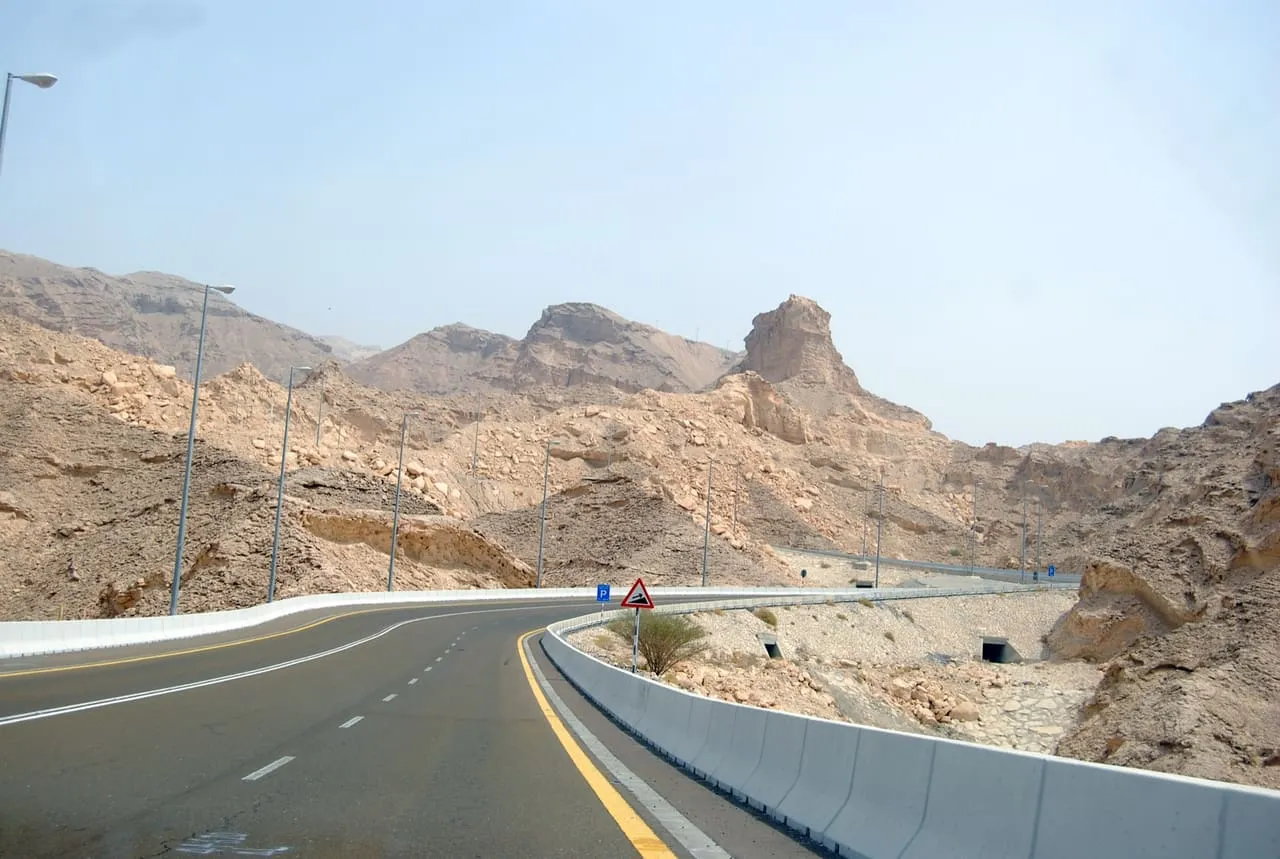 The road climbing Jebel Hafeet past bare rock, on the way to the summit above Al Ain