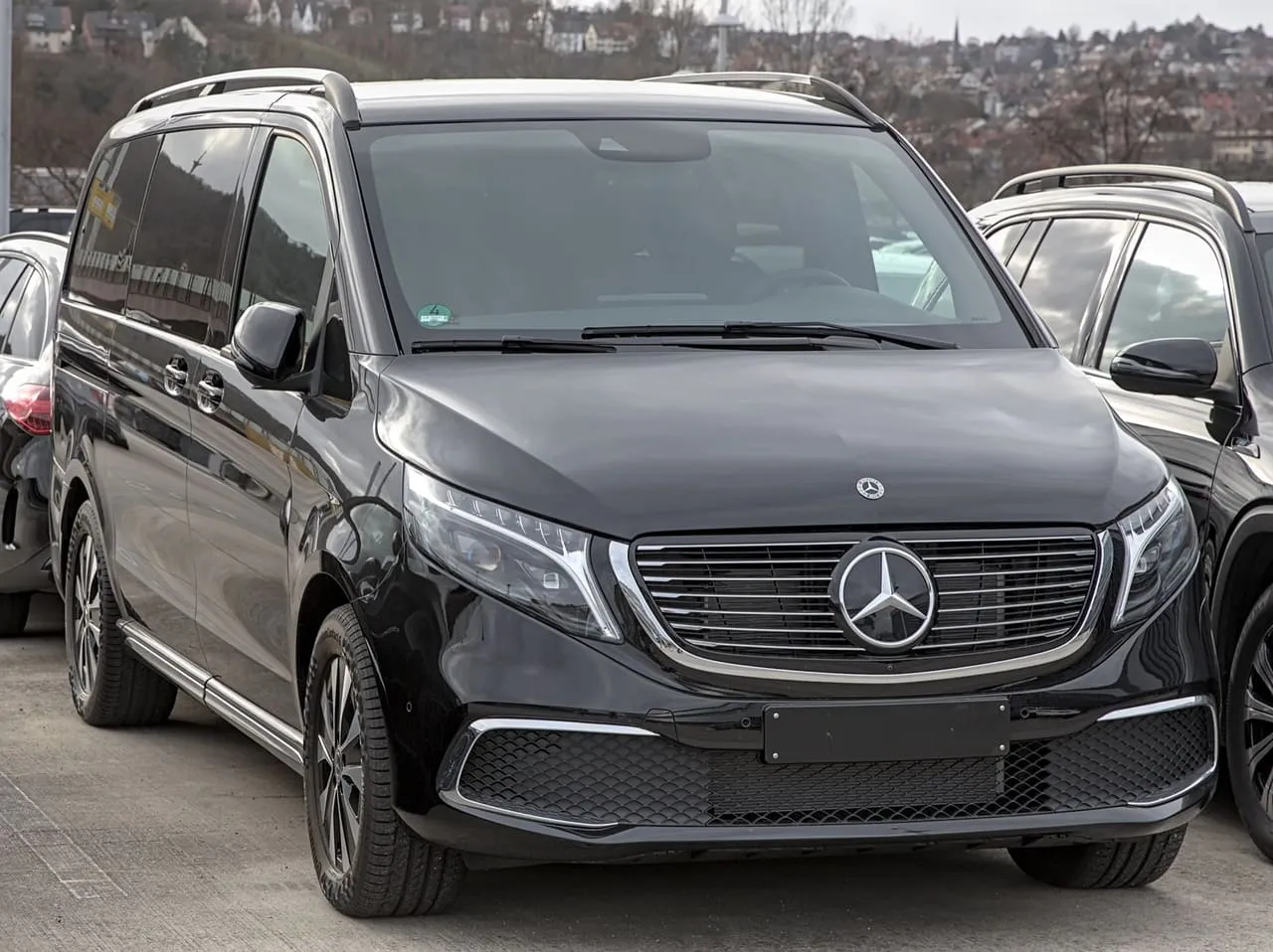 A black Mercedes-Benz V-Class people carrier, front three-quarter view