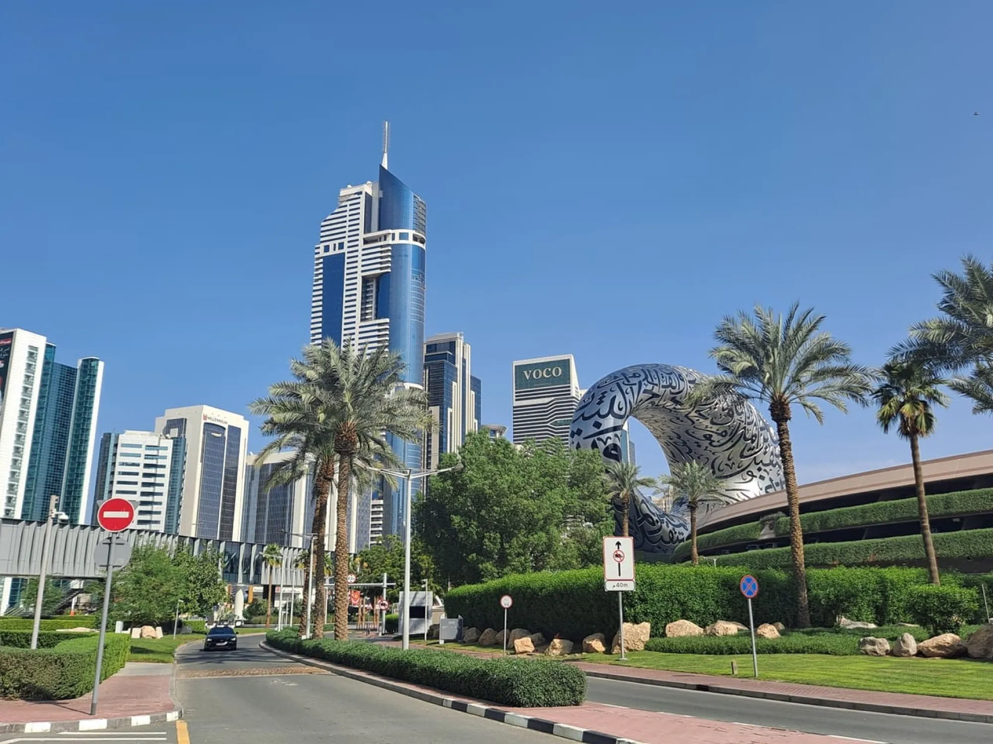 Sheikh Zayed Road business district with the Emirates Towers and the Museum of the Future