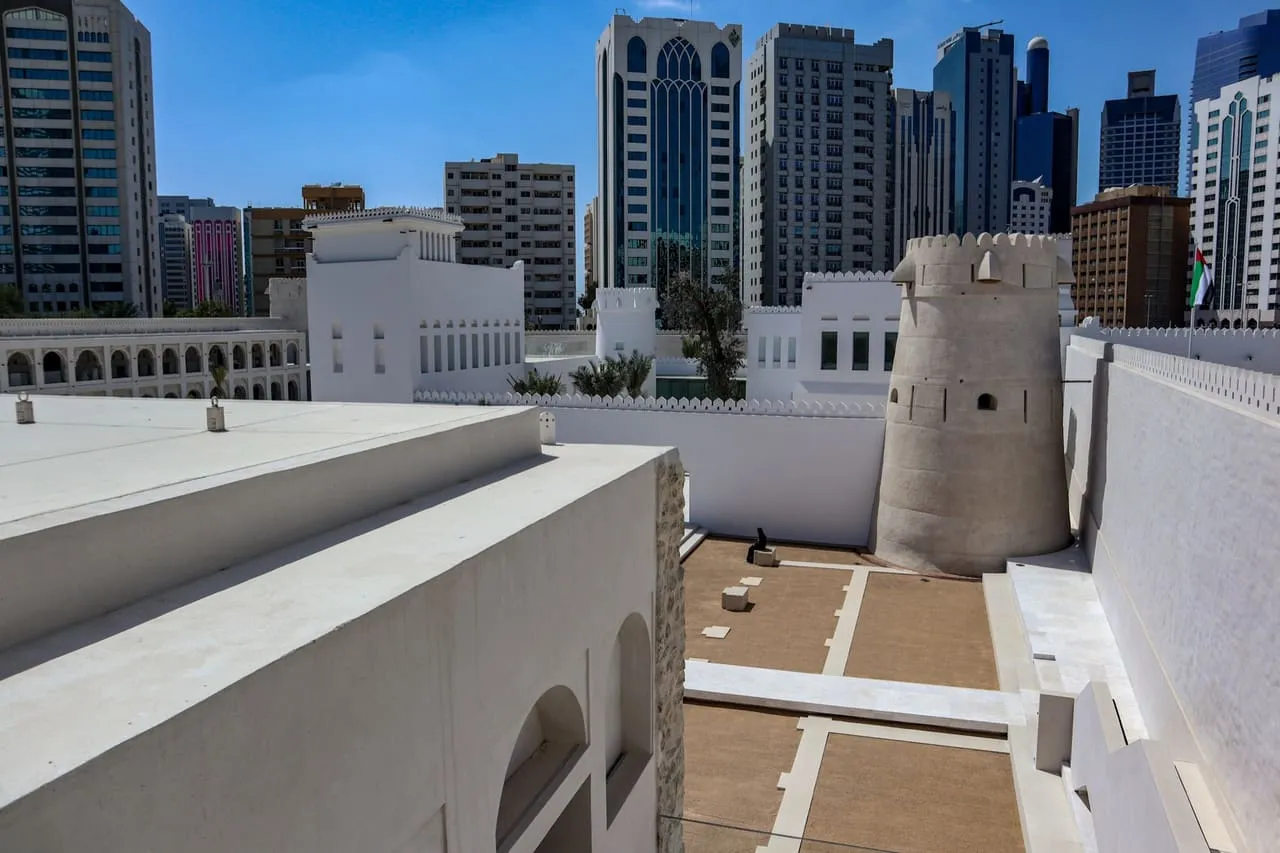The old watchtower of Qasr Al Hosn in front of the towers of central Abu Dhabi
