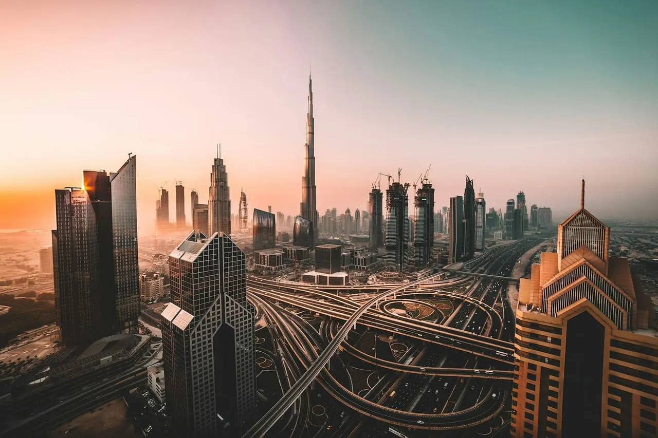Sheikh Zayed Road, the E11, and its interchanges below the Burj Khalifa in low golden sun