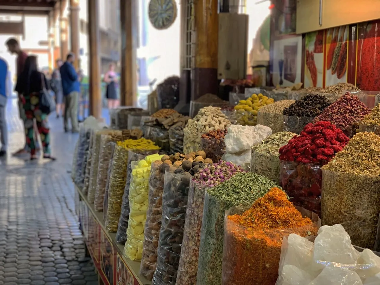 Open sacks of spices, dried flowers and herbs along a lane of the Spice Souk in Deira