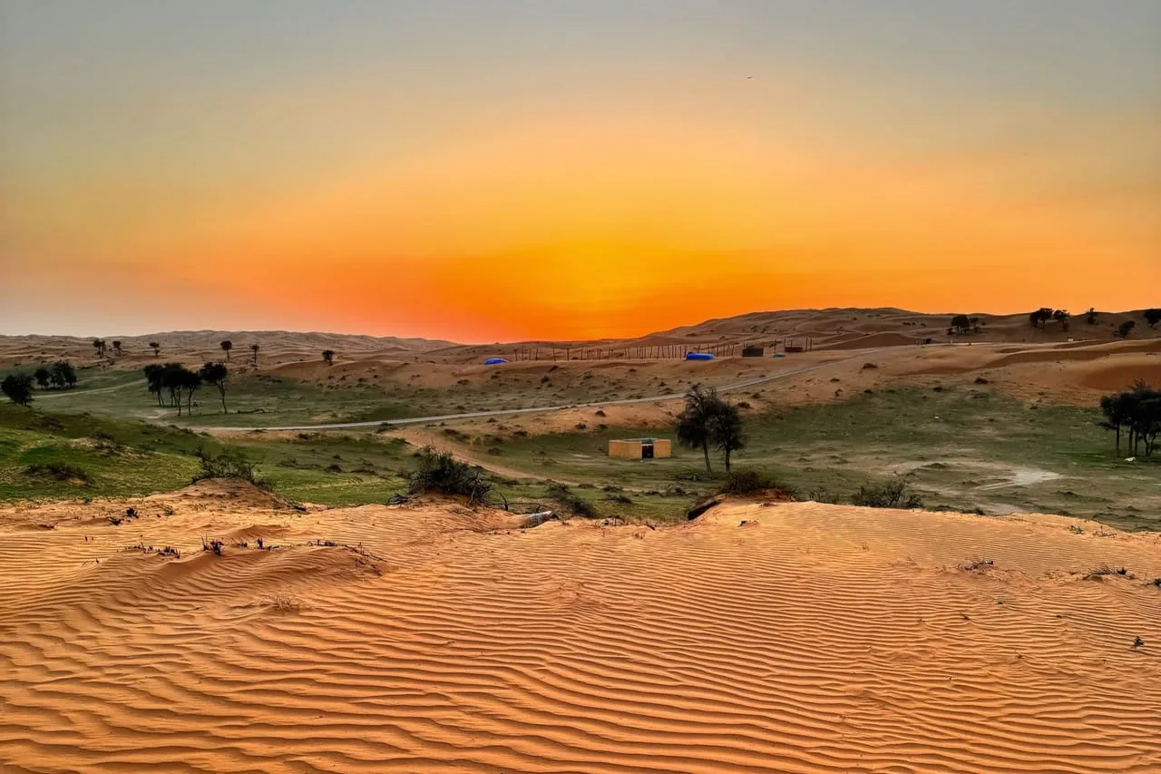 Sunset over rippled red dunes in the Al Wadi desert of Ras Al Khaimah