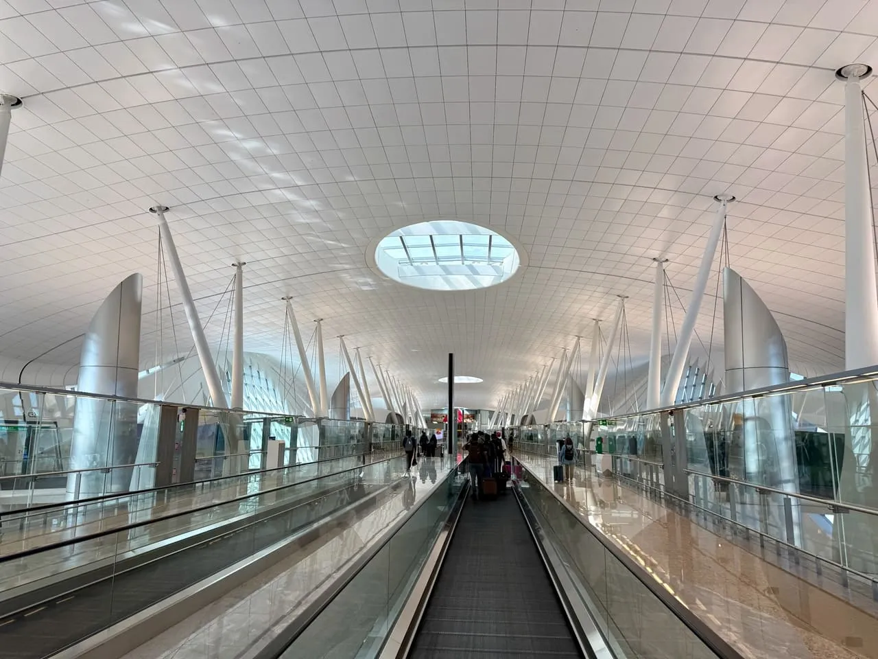A moving walkway along a pier in Terminal A at Zayed International Airport