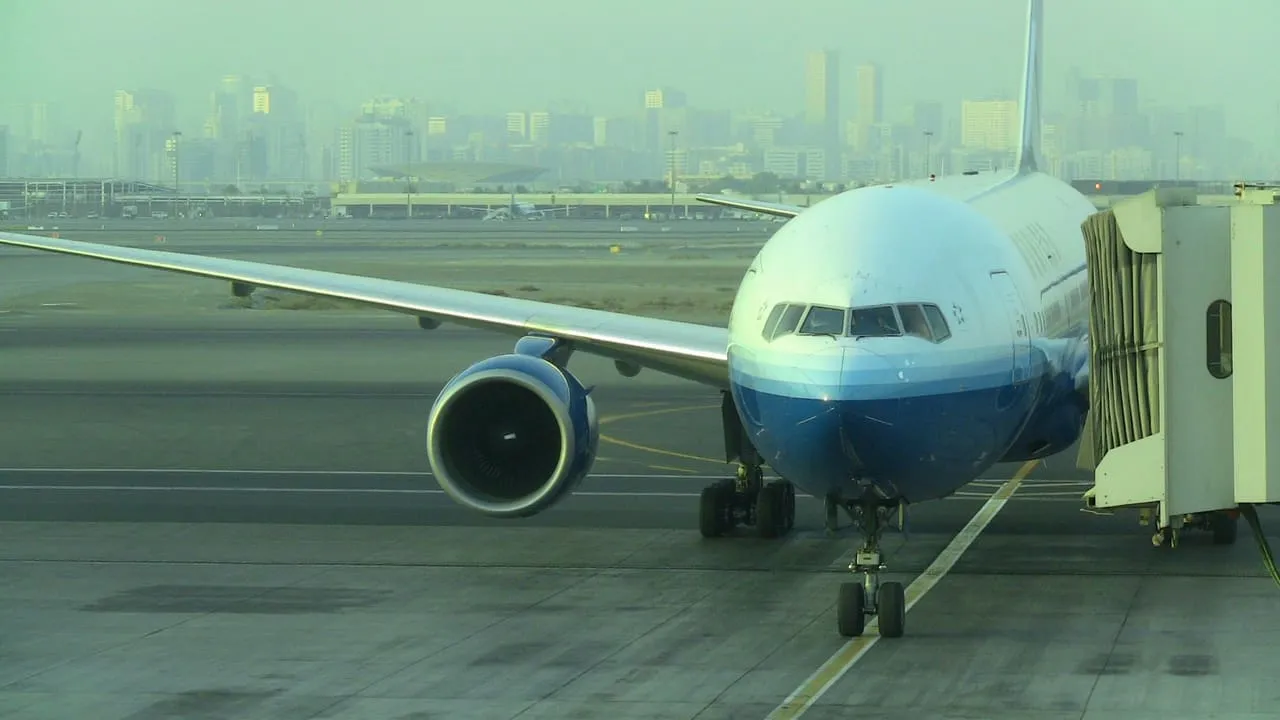 A United Airlines Boeing 777 docked at a Terminal 1 gate at Dubai International in 2012