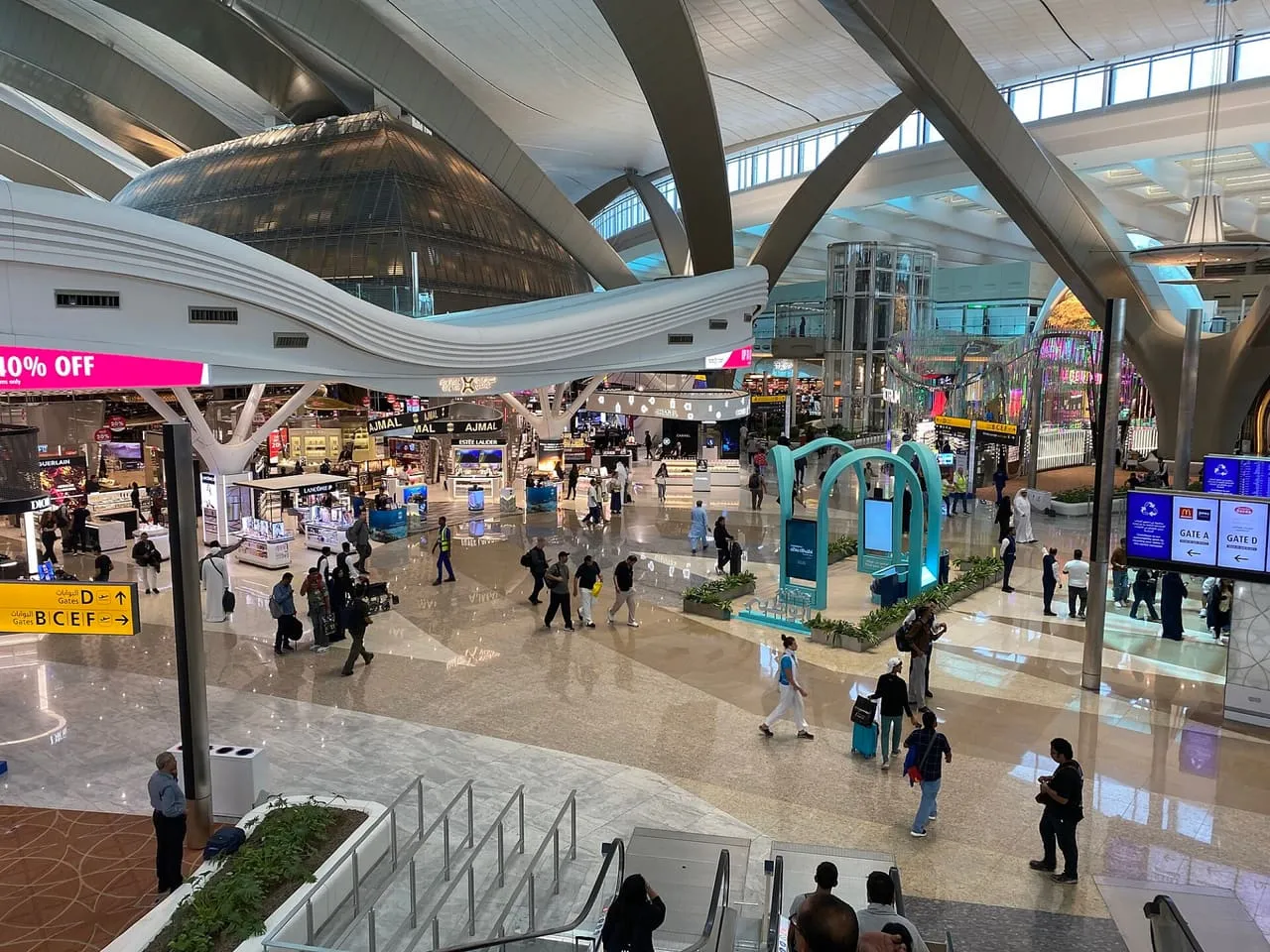 The central hall of Terminal A at Zayed International Airport in Abu Dhabi, with signs to Gates A to F